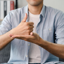 A person communicating in sign language